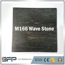 Sliding the tiles into place will push up the adhesive and make the tiles uneven, causing them to crack. China Building Material Uneven Surface Black Marble Wave Stone Bluestone Tiles China Flooring Tile Marble Countertop