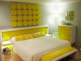Here, yellow walls serve as a pop of color in a room that features a black and white color scheme. Yellow Bedrooms Pictures Options Ideas Hgtv