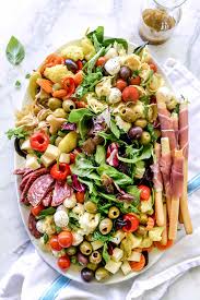 In a jar fitted with a lid, shake together olive oil, vinegar, mustard, oregano,. How To Make An Awesome Antipasto Salad Platter Foodiecrush Con