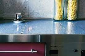 Beautiful nyc kitchen incorporates black limba wood, various metals, custom stainless steel cabinetry, reclaimed glass and many other industrial materials. Larger Format Tiles For Kitchen Countertops Conestoga Tile