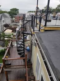 Permanent ladders and stairs install to or on a roof shall comply with the following minimum design criteria: 156 O St Roof Deck With Spiral Abacus Builders