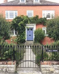 The earthy gold stone on this house combined with the creamy beige brick dictate a very custom coloured roof but this roof is reddish pink and again looks patchy. Front Door Colors For Brick Houses