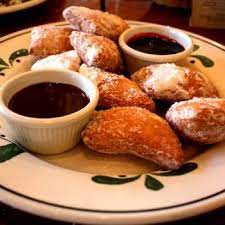 Dark chocolate cake with chocolate mousse & caramel cream: Olive Garden Secret Menu Items Olive Garden Desserts Zeppoli Recipe Zeppole Recipe