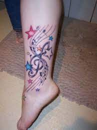 The colors make you think of the universe at large. Little Colorful Stars Music Tattoo Designs Music Notes Tattoo Tattoo Designs