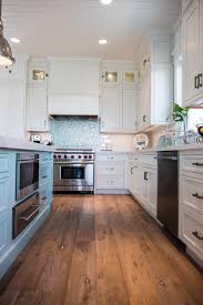 Creamy white countertops and pendant lights function like whitecaps in a blue sea, and create a. Coastal Kitchen In Blue And White Town Country Living