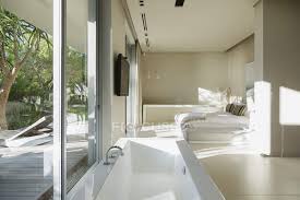 If it is designed correctly our bedrooms are soothing sanctuaries full of cozy bedding and peaceful decor that make you feel both happy and calm. Bathtub In Modern Master Bedroom Interior Flat Screen Real Estate Stock Photo 199885186