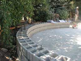 Years ago, when we first starting bringing back curved stone wall toppers from england and turning them into benches, we kept a couple of the very best for ourselves. Curved Bench For Garden Terraced Patio Ideas Cinder Block Garden Cinder Block Garden Wall