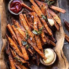Garlic Parmesan Sweet Potato Fries With Spicy Aioli Half Baked Harvest Recipe In 2020 Parmesan Sweet Potato Fries Sweet Potato Fries Fried Potatoes