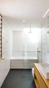 Beige and black bathroom design features a black framed mirror mounted over a beige bath vanity with black and white mosaic stacked backsplash wall tiles, a sink with a matte black gooseneck faucet and black chevron bath floor tiles. 73 Black And White Bathroom Fresh Cool Bathroom Design