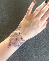 A tiny bunny and moon: My Wrap Around Wrist Of Flowers Done By Laura MorkunaitÄ— At Ink Factory Kaunas Lithuania Tattooantra