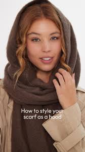 Save this video for the next time you want to style your scarf as a hood  🧣, 1. Wrap both ends of the scarf around your neck, 2. Tuck both ends of  the scarf into the loop , 3. Pull the hood up at the ...