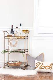 Last Minute Holiday Decorating Ideas Glam Up Your Bar Cart With Gold Silver Home Decor Chic Glasswares Or Spa Gold Bar Cart Holiday Bar Cart Bar Furniture