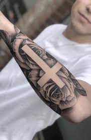 Meanwhile, a cross with a biblical passage is. 30 Best Cross Tattoos For Religious Men In 2021 The Trend Spotter