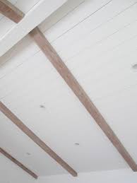White shiplap ceiling with wood beams. How To De Orange Wood Beams The Vintage Rug Shop In 2020 Painted Wood Ceiling Shiplap Ceiling Wood Beam Ceiling