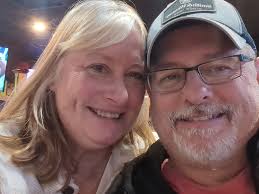 Hi all! I just wanted to introduce myself and share a photo I took. My wife  and I enjoying each other's company. I am sure we are enjoying a pint of our