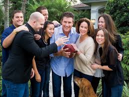 Dan Marino and his wife Claire pose for a photo for Ocean Drive Magazine  along with 6 of their 7 children; Joey, Michael, Daniel, Lia, Ali, Nikki  and the family dog Sammy.