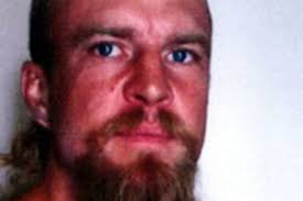 Wanted man 'has two firearms': police search bushland for Rowley