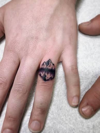 Mountain lake view wedding band tattoos in fine line black and grey 🏔️ 🌲  🏕️ ❤️ (Artist: Marshall Stokes) Finger tattoos, matching tattoos, fine  line tattoo shop Carson City, Reno fine line