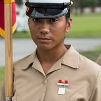 A member of an armored unit models his helmet and uniform at Skidgel Hall,  U.S. Army Armor Center. (substandard)