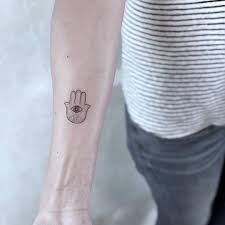Small spiritual jesus cross tattoo. Hamsa Tattoo Tattoo Designs For Women