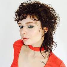 Warm Brunette Shaggy Mullet With Messy Curly Texture And Undone Fringe Short Hair Styles Mullet Hairstyle Damp Hair Styles