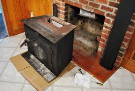 A prefab fireplace is an appliance not unlike a stove. The Beginning Of A Fireplace Makeover Removing A Woodstove Insert Young House Love