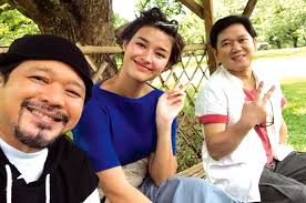 Brothers Herbert and Hero Bautista carry