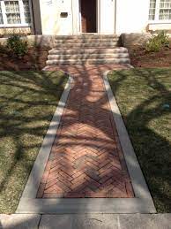 Fan laying patterns make for welcoming entrance and exit points to walkways. Pavers In Herringbone Pattern Houzz