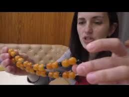 Amber apple, Rivne amber stone and a brooch with hardened amber.