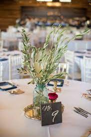 Olive Tree Branches Centerpieces Rustic Minimal Sophisticated Wedding At The Fields Tree Branch Centerpieces Branch Centerpieces Branch Centerpieces Wedding