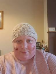 Woman makes cardigan for chemo treatment