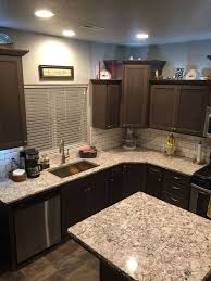 A kitchen dominated by dark tones is designed with marble countertop, black backsplash tile and dark cherry wood cabinets. 64 Best Backsplash With Dark Cabinets Ideas Backsplash With Dark Cabinets Kitchen Remodel Kitchen Renovation
