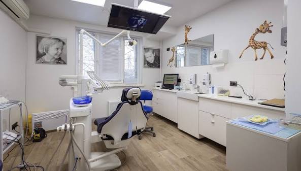 Dentist giving dental checkup to patient at Smile Focus Dental