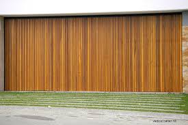 We have a cedar board and batten raised ranch, that has been stained very dark brown since it was built, in the 60s. Danmar Cedar Batten Panel Dynasty Garage Doors