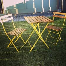 Old Weathered Ikea Bistro Table Up Cycled And Given New Life A Can Of Rustoleum Sun Yellow And Some Polyur Bistro Table Outdoor Indoor Furniture Bistro Table