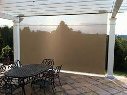 A traditional pull cord raises and lowers the shade, making height adjustment a snap. Drop Down Sun Shades Outdoor Eclipse Vertical Drop Retractable Solar Screen Roll Up Window Shades Patio Sun Shades Patio Shade Sun Shades For Patio