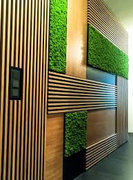 Despite Their Skewed Arrangement The Alternation Of Striped Wood Smooth Wood And Greenery Balance Foyer Design Office Interior Design Interior Design Atlanta