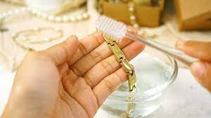 If your gold is tarnished, you can usually clean it with dish soap and water. 4 Ways To Clean Gold Jewelry Wikihow