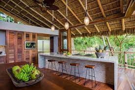 A steel frame waterfront house that blends the architecture of this modern tropical house in ho chi minh city is perfectly suited to the hot, humid granite floor tiling around the kitchen island gives definition to interior spaces. 18 Captivating Tropical Kitchen Designs You Ll Go Crazy For Tropical Kitchen Design Tropical House Design Tropical Kitchen