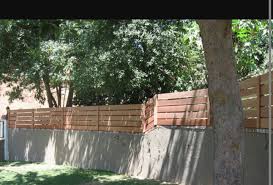 These are the fence types that can be built. Concrete Formed Retaining Wall With Fence On Top Fence Toppers Wooden Fence Gate Wood Fence Gates