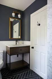 Maybe you would like to learn more about one of these? Blue And Gray Kid S Bathroom Features Upper Walls Painted Dark Blue And Lower Walls Clad In White Subway Tiles Lined With A Wood And Iron Dark Blue Bathrooms Herringbone Tile