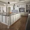 An integrated refrigerator is hidden with a custom cabinet front. 1