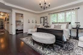 While the room's size dictates a good portion of your design, even the smallest master comes with options. Large Master Bedroom Layout With Lounge Furniture Sleigh Bed And Round Plush Ottoman Master Bedroom Layout Large Master Bedroom Ideas Large Bedroom Layout