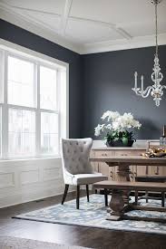 Regardless of the color you choose, paint the ceiling and trim white for a crisp finish. White Wainscoting Trim And Ceiling Paint Color Is Benjamin Moore Simply White With Dark Charcoal W Dark Dining Room Dining Room Wainscoting White Wainscoting