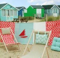 Windbreaks Are As Much A Part Of The British Seaside Scene As Beach Huts Punch Judy Donkey Rides And Sand In The Cornet Beach Hut Decor Seaside Beach British Seaside