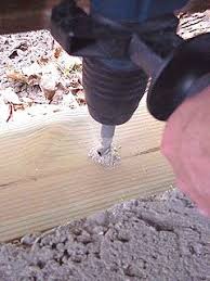 Drilling Hole In Bottom Plate And Concrete Floor To Install Anchor Garage Walls Garage Garage Lift