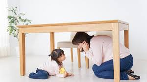 They're hanging up door curtains that shield a classroom. Talking To Children About Lockdown Drills U Gro Learning Centres