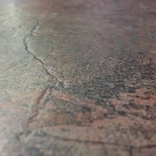 Vinyl plank flooring originally became popular because it mimicked wood plank flooring very convincingly—more so than even plastic laminate. Engrave Copper Slate Vermont Luxury Vinyl Tile 1703