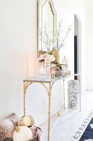 A White Foyer Goes Glam With Gold Pink And Silver Fall Decor Accents On A Bamboo Console Table In 2020 Entry Table Decor Foyer Decorating Decor