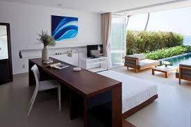 Storage above helps to keep the office space neat and organized. 10 Beautiful Master Bedrooms With Desk Setups